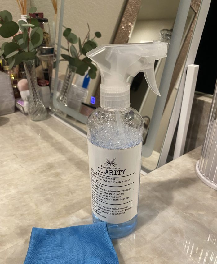 A Leal&rsquo;s Clarity spray bottle with a microfiber cloth