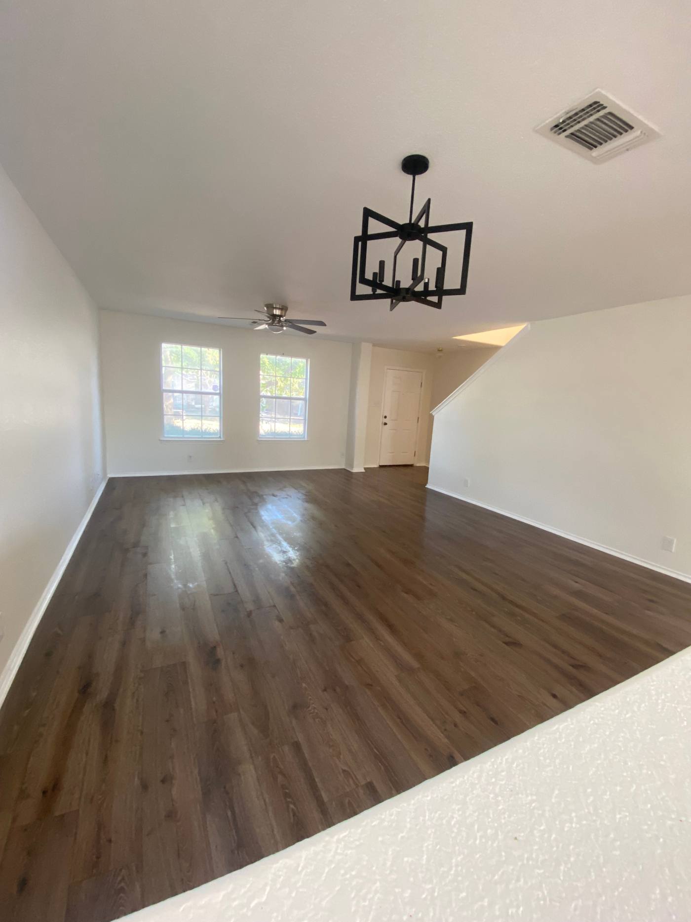 An empty living room cleaned and ready for move-in