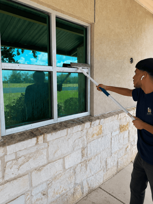 Washing an exterior window with a squeegee